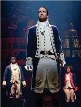  ??  ?? Founding Father: Lin-manuel Miranda (centre), writer and star of
Hamilton