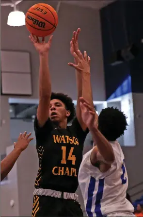  ?? (Arkansas Democrat-Gazette/Colin Murphey) ?? Christophe­r Fountain (14) of Watson Chapel puts up a shot over a Sylvan Hills defender Tuesday during the Wildcats’ 54-51 victory over the Bears in Sherwood.