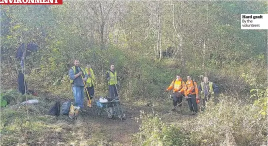  ??  ?? Hard graft By the volunteers