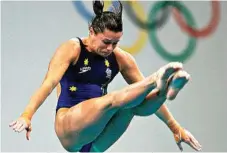  ?? Photo: Daniel Berehulak/Getty Images ?? MEDALLIST: Chantelle Newbery competes in the women’s diving 10m platform final at 2004 Athens Olympics.