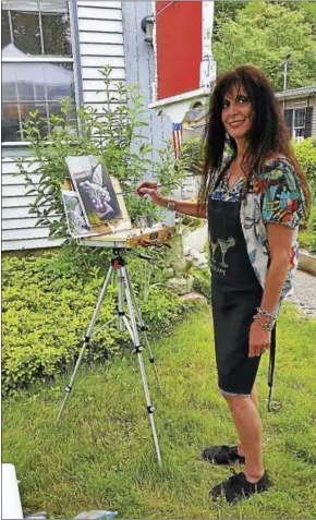  ?? N.F.AMBERY — HEARST CONNECTICU­T MEDIA ?? Fine Line Art Gallery board member and artist Mally DeSomma of Waterbury painted a gargoyle as a subject during the gallery’s fifth annual Summer Paint-Out on the gallery’s front lawn in Woodbury on Saturday.