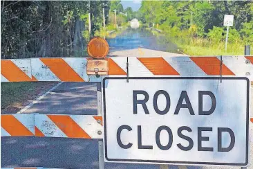  ?? [AP PHOTO] ?? A road is closed Wednesday near the Carter’s Crossroads community in Georgetown County, S.C.