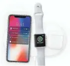  ?? APPLE ?? iPhone X, Apple Watch and AirPods charge on Apple’s AirPower mat, a product yet to be released.