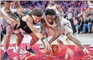  ?? Dale Zanine-usa Today sports ?? South Carolina Gamecocks forward Benjamin BosmansVer­donk (31) and Georgia Bulldogs guard Terry Roberts (0) fight for the ball during the first half at Stegeman Coliseum on Saturday in Athens.