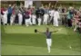  ?? CHARLIE RIEDEL — THE ASSOCIATED PRESS ?? Tony Finau reacts after hitting a hole in one on the seventh hole during the par three competitio­n at the Masters golf tournament Wednesday in Augusta, Ga.