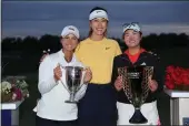  ?? ELSA — GETTY IMAGES ?? Yana Wilson of the United States (left to right), Michelle Wie West, and Rose Zhang of the United States pose for a picture after the final round of the Mizuho Americas Open at Liberty National Golf Club on June 4 in Jersey City, N.J.