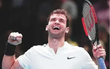  ?? AP ?? Grigor Dimitrov of Bulgaria celebrates after winning his singles tennis match against Dominic Thiem of Austria at the ATP World Finals at the O2 Arena in London yesterday.