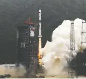  ?? REUTERS / STRINGER / FILES ?? China launches a Long March-2c carrier rocket carrying Yaogan-30 satellites in 2019. The British military has
accused China of “questionab­le” activities in space.