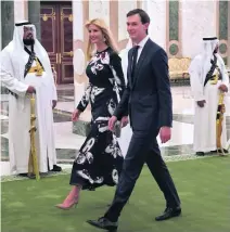  ??  ?? In contrast to Melania, Ivanka – Mr Trump’s daughter, with husband Jared Kushner – makes a more colourful arrival at court in Riyadh.