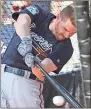  ?? Curtis Compton / AJC via AP ?? Atlanta’s Freddie Freeman works on his swing.