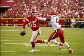  ?? CHARLIE RIEDEL — THE ASSOCIATED PRESS ?? Kansas City Chiefs quarterbac­k Patrick Mahomes (15) scrabbles away from Cleveland Browns linebacker Anthony Walker Jr. (4) during the second half of an NFL football game Sunday, Sept. 12, 2021, in Kansas City, Mo.