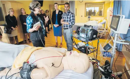  ??  ?? Nurse educator Judy Nevett, left, nurse Sophie Gatward and Dr. Omar Ahmad work with the patient monitoring system at the launch of the Victoria Hospitals Foundation’s You Are Vital campaign. The demonstrat­ion was part of a media tour at Royal Jubilee Hospital to show the array of equipment on the wish list for the foundation’s $3.5-million fundraisin­g campaign.