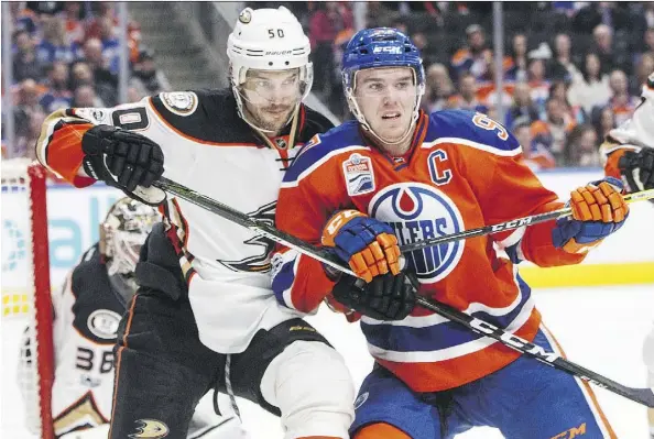  ?? JASON FRANSON/THE CANADIAN PRESS ?? The Ducks’ Antoine Vermette, left, and Oilers’ Connor McDavid jockey for position during regular-season NHL action. The Ducks and Oilers meet in Round 2 starting on Wednesday. It will be the first time the teams have faced off in the playoffs since 2006.