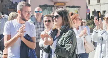  ?? — Reuters photo ?? Deputy mayor of Vielha, Maria Verges Perez (right), takes part in a demonstrat­ion in favour of dialogue, in Vielha, in the Val d’Aran, Catalonia, Spain.