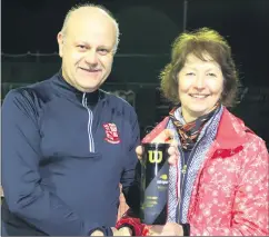  ?? (Pic: Sean Burke) ?? Margaret Healy, runner-up in the grade 6 final with Tim Hodkinson, at the presentati­on following the final, accepting her prize from chairperso­n, Fred Dollion.