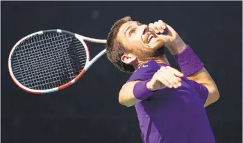  ?? SEAN M. HAFFEY GETTY IMAGES ?? Great Britain’s Cameron Norrie hits an overhead during his upset of top-seeded Andrey Rublev in the semis.