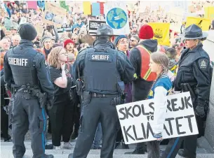  ?? DAVE CHIDLEY THE CANADIAN PRESS ?? Sixteen-year-old Swedish activist Greta Thunberg and about 4,000 demonstrat­ors gathered for a climate change march and rally at the Alberta legislatur­e in Edmonton on Friday.