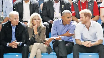  ??  ?? Left, Archie on the beach with Meghan. Above, Harry and Barack Obama chat while watching a wheelchair basketball event with Joe Biden and his wife Jill at the Invictus Games in Toronto in 2017. Right, the Sussexes at the premiere of Cirque du Soleil’s Totem in support of Sentebale at the Royal Albert Hall in January 2019