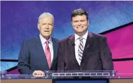  ?? JEOPARDY PRODUCTION­S INC. /COURTESY ?? Eric R. Backes of Oviedo, right, with ‘Jeopardy!’ host Alex Trebek.