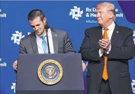  ?? John Amis The Associated Press ?? President Donald Trump applauds drug addiction survivor Alex Elswick during the RX Drug Abuse & Heroin Summit on Wednesday in Atlanta.