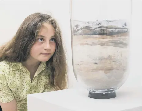  ?? ?? Young Matilda is looking at Earth’s history in Katie Paterson’s piece, Requiem, at National Glass Centre.