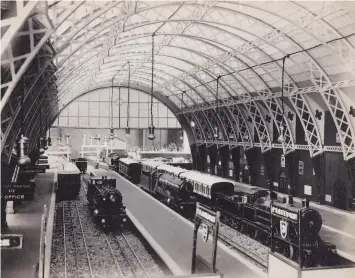  ??  ?? Under the grand all-over terminus roof. The Nord 4-6-0 is on the left, “Great Bear” in the centre, at Platform2, and a LNWR 4-4-0 arriving with a train of LNWR tinplate coaches at Platform 3.