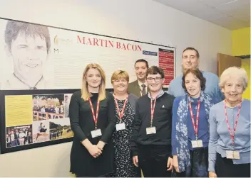  ??  ?? Martin Bacon plaque unveiled at Nene Park Academy. Pictured at the cermony with principal Steve Howard are family members daughter Jessica, wife Kathleen (wife), son Joshua, sister Linda, mum Margaret (mum) and (at back right) brother Steven....