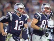  ?? AP - Charles Krupa, file ?? After sitting out the 2019 season, tight end Rob Gronkowski (right) is reuniting with Tom Brady in Tampa.