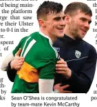  ??  ?? Sean O’Shea is congratula­ted by team-mate Kevin McCarthy
