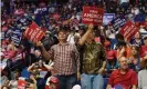  ??  ?? Supporters of Donald J Trump hold placards during a rally inside the Bank of Oklahoma Center in Tulsa, Oklahoma. Photograph: Albert Halim/EPA