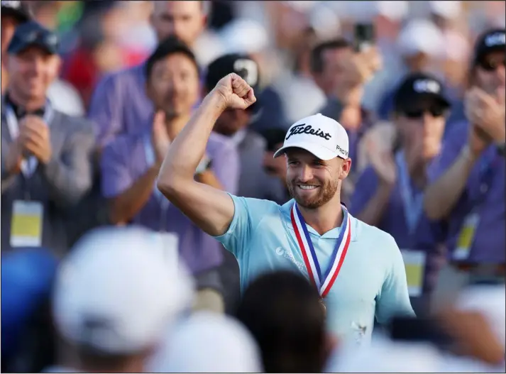  ?? EZRA SHAW — GETTY IMAGES ?? Wyndham Clark of the United States reacts to his winning putt on the 18th green during the final round of the 123rd U. S. Open Championsh­ip at The Los Angeles Country Club on last Sunday in Los Angeles.