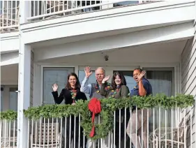  ?? DEB CRAM/PORTSMOUTH HERALD ?? The Anchorage Inn in York will join the Festival of Lights with a fireworks show at Long Sands beach and a visit from Santa Claus on Saturday. From left: Caitlynn Ramsey, her father Ray Ramsey, Margaret Carcaterra and Novi Mullings.