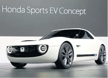  ?? REUTERS ?? At the show, Honda Motor Co introduces three electric vehicles, including its Honda Sports EV Concept, a small sports car equipped with AI technologi­es that interact with the driver to make route suggestion­s.