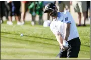  ?? DARRYL WEBB — THE ASSOCIATED PRESS ?? Adam Hadwin chips to the ninth green during the first round of the Phoenix Open on Thursday in Scottsdale, Ariz.