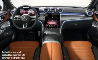  ??  ?? Portrait-orientated central touchscree­n sits between the front seats