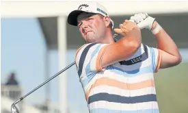  ??  ?? Marc Leishman tees off on the 17th hole during the first round.