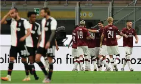  ??  ?? Milan’s Portuguese forward Rafael Leao is congratula­ted after scoring the third goal in the 4-2 defeat of Juventus. Photograph: Miguel Medina/AFP/Getty Images