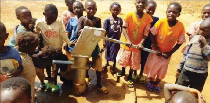  ??  ?? Dauda and other pupils of LGEA Primary School enjoying water facility donated by UNICEF with support from European Union