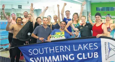  ?? PHOTO: TRACEY ROXBURGH ?? Mission complete . . . Members of the Southern Lakes Swimming Club, including Martin Martinezd’Orso (centre front) and supporters after finishing their marathon 24hour swim to raise money for St John in Queenstown yesterday.