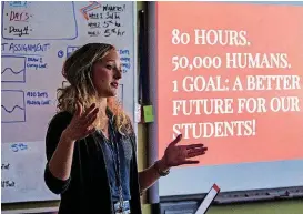  ?? [PHOTOS BY CHRIS LANDSBERGE­R, THE OKLAHOMAN] ?? Roosevelt Middle School art teacher Katie Guthrie talks to her students about the statewide teacher walkout on Monday, the first day back for teachers and students.