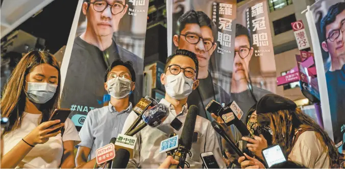  ??  ?? Pro-democracy activist Nathan Law speaking to the media last month.