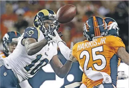  ?? Jack Dempsey Associated Press ?? RAMS WIDE RECEIVER Pharoh Cooper (10) gets behind Broncos cornerback Chris Harris Jr. to catch a pass thrown by quarterbac­k Jared Goff during the first half at Denver. The play covered 19 yards and was the 21-year-old rookie’s only reception of the...