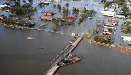  ?? David J. Phillip / Associated Press ?? A barge settles on a bridge after Hurricane Ida in Lafitte, La. Houston’s relatively good luck continues, but for how long?