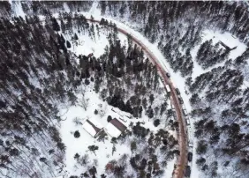  ?? USA TODAY NETWORK ?? Law enforcemen­t vehicles stand near the cabin where Jayme Closs, 13, was held in Gordon, Wis. Jayme was missing for nearly three months before she escaped the house Thursday and asked a stranger for help.