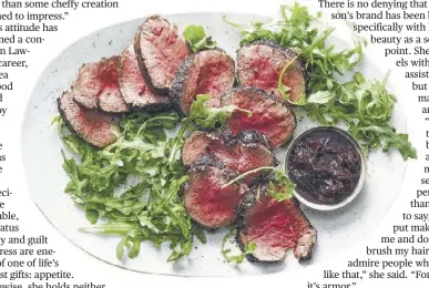  ?? Julia Gartland / New York Times ?? Beef tenderloin with red wine, anchovies, garlic and thyme is served with arugula from Lawson’s iconic cookbook “How To Eat.”