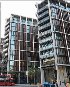  ??  ?? On the market: one of the kitchens and a sitting room in the apartment on the seventh floor of one of the three One Hyde Park towers, left. Inset, Nick Candy and Christian Candy