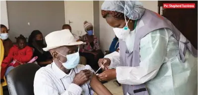  ??  ?? An elderly man receives his first dose of the COVID-19 vaccine at Edith Opperman Clinic in Mbare, Harare, yesterday
Pic: Shepherd Tozvireva