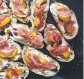  ??  ?? Peach and prosciutto bruschetta.