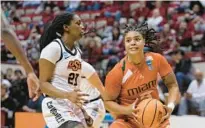  ?? DARRON CUMMINGS/AP ?? Miami’s Destiny Harden goes to the basket against Oklahoma State’s Terryn Milton on Saturday in n Bloomingto­n, Ind.