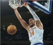  ?? ANDRES KUDACKI — THE ASSOCIATED PRESS FILE ?? Willy Hernangome­z dunks against the Kings during game at Madison Square Garden. The Knicks agreed to trade Hernangome­z to the Hornets for a pair of second-round picks and Johnny O’Bryant.